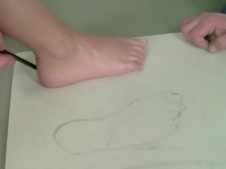 Glorious cutie giving footjob and riding dick