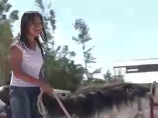 Chick from Thailand riding a horse