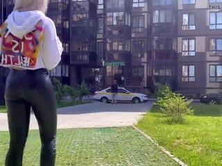 Blonde street girl is showing her leather leggings ass in public!